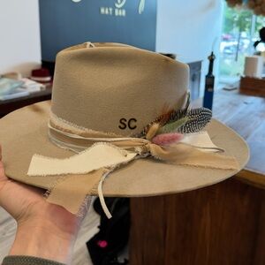 Stylish Tan hat with Feather Accent